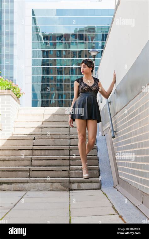 Young African American Woman Walking Down Outdoor Stairs In Urban