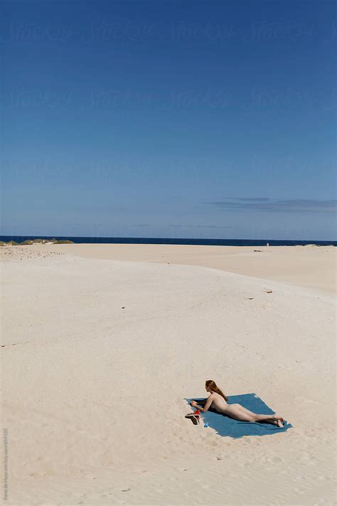 Naked Woman Lying On Deserted Beach By Rene De Haan