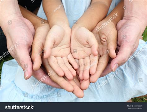 Adult Hands Holding Kid Hands Stock Photo 133898864 Shutterstock