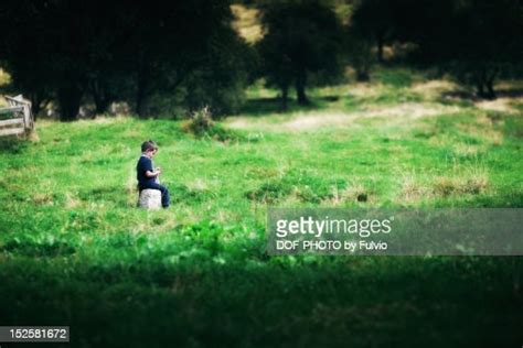 Little Cute Boy Sitting Alone High Res Stock Photo Getty Images
