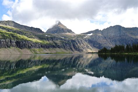 Mirror Like Reflection On Hidden Lake In Glacier National Park Montana