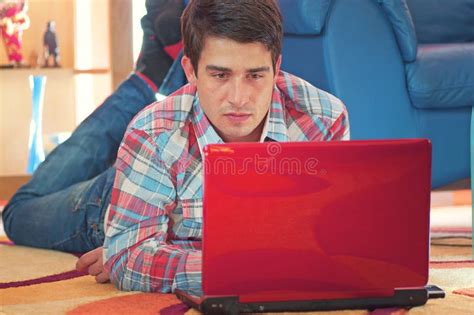 Handsome Guy Using Laptop While Lying On A Floor Stock Image Image Of Home Background 17724197