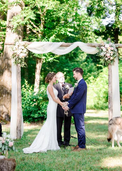 Romantic Wooden Arbor For The Wedding Ceremony Draped In Soft White