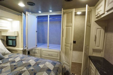 The bedroom is a cozy retreat where we can relax and unwind. Luxury toy hauler bedroom closet | Home appliances, Luxury ...