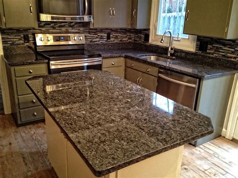 15 green kitchen backsplash ideas to transform your cook space. sage green cabinets with dark granite and glass backsplash ...