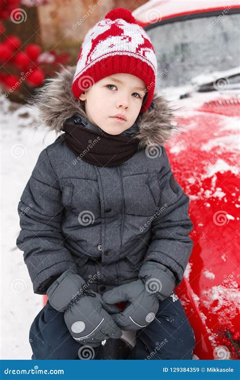 Boy S Portrait Outdoors Sitting On A Red Car Stock Image Image Of