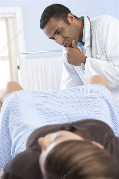 Gynaecologist During An Examination Stock Image F Science Photo Library
