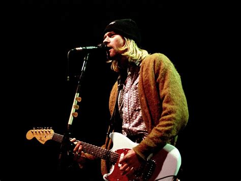 Kurt cobain, american rock musician who rose to fame as the lead singer, guitarist, and songwriter for the seminal grunge band nirvana, known for such hits as 'smells like teen spirit.' Kurt Cobain Sweater Worn on 'MTV Unplugged' Up For Auction