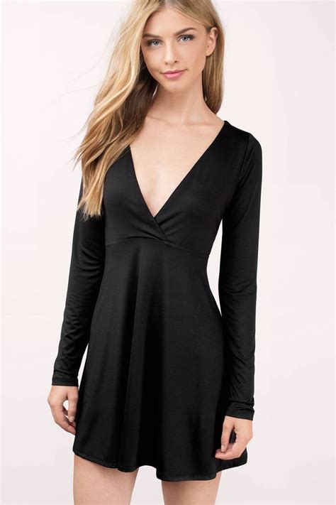 Turn Heads In This Black Skater Dress With A Deep V Neckline Wear With