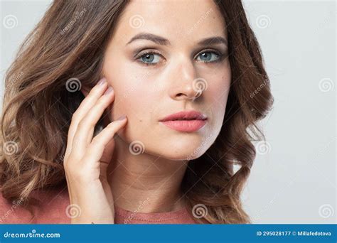 Good Looking Woman With Clear Perfect Skin Makeup And Wavy Brown Hair