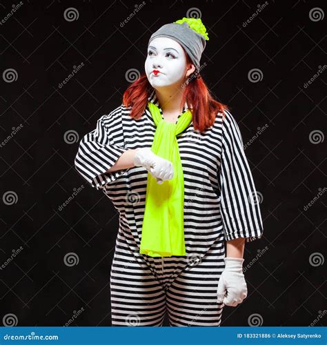 Portrait Of Female Mime Artist Isolated On Black Background Young
