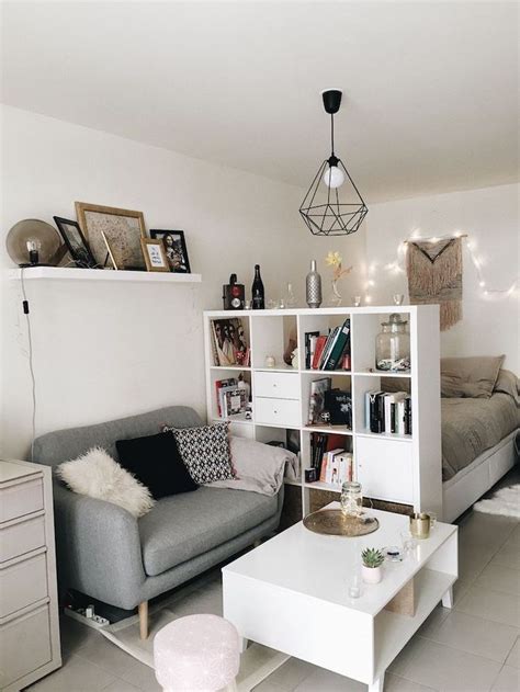 Maybe you would like to learn more about one of these? white bookshelf, room divider, small grey sofa, white ...