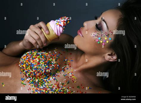 Nude Woman With Sprinkles Eating Ice Cream Stock Photo Alamy