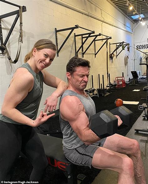 hugh jackman continues his long running feud with ryan reynolds by showing off his impressive