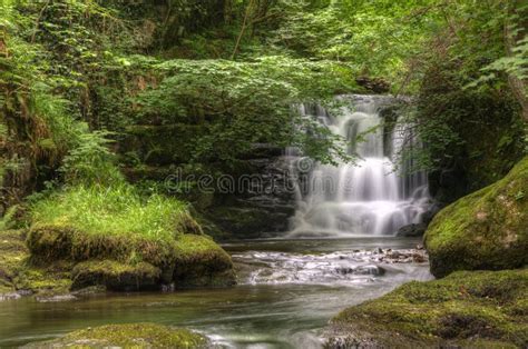 Stunning Waterfall Flowing Over Rocks In Forest Stock Image Image Of