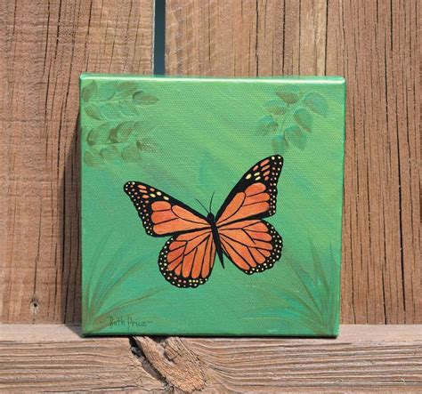 A Painting Of A Butterfly On A Green Background With Wood Planks And