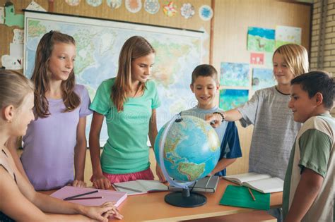 Schoolchildren In A Geography Lesson Stock Photo - Image of together ...