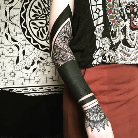 These Striking Solid Black Tattoos Will Make You Want To Go All In