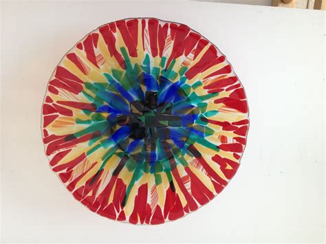 A Colorful Glass Plate Sitting On Top Of A White Table