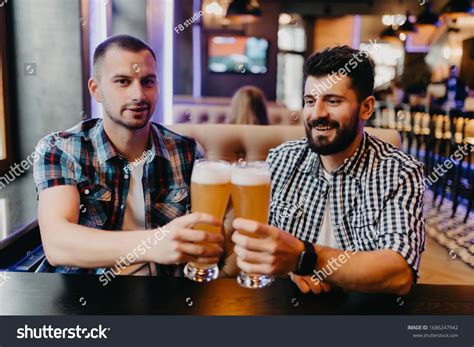 Two Men Drinking Beer In Bar Clinking Beer Have Fun In Pub Ad Paid Beer Drinking Men Bar