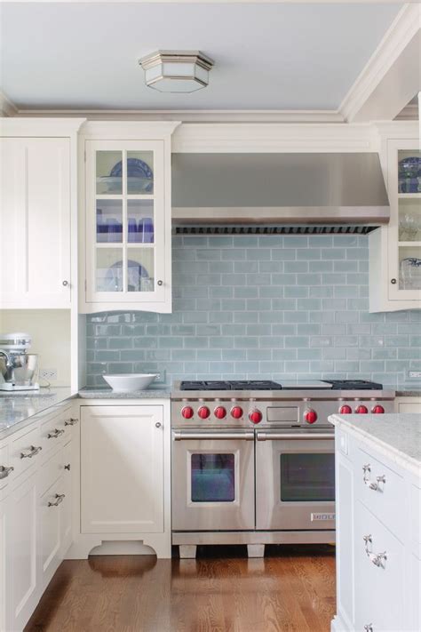 White Kitchen Design With Stainless Steel Design And Light Blue Subway