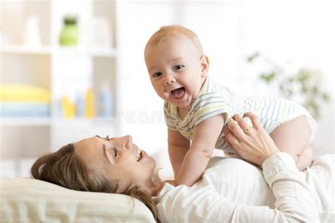Happy Mother Playing With Newborn Baby Stock Image Image Of Beautiful