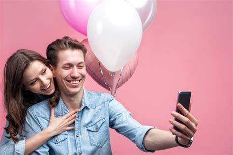 Premium Photo Celebrating Couple Taking Selfie