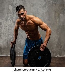 Muscular Man Naked Torso Holding Weights Stock Photo Shutterstock
