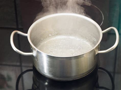 stainless steel pan with boiling water on the stove stock image image of homemade cream