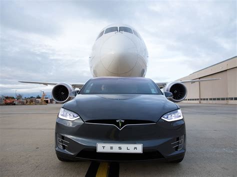 Watch A Tesla Model X Tow A Passenger Plane Carbuzz