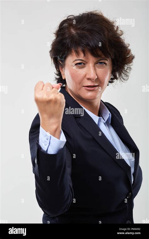 Mature Businesswoman Aggressively Showing Her Fist Stock Photo Alamy