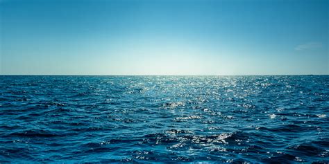 Blue Ocean Panorama With Sun Reflection The Vast Open Sea With Clear