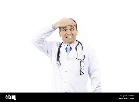 Shocked Doctor Covering Forehead With Hand Because Of Mistake Stock