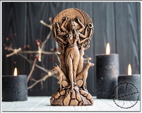 A Wooden Statue With Candles In The Background