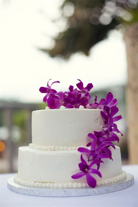Vendors involved in this project: Two-Tier Wedding Cake With Purple Orchids