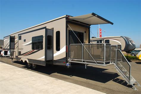 Check Out This 2014 Sandpiper Fifth Wheel With A Full Rear Patio Lake