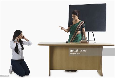 Female Teacher Punishing A Student In A Classroom Photo Getty Images