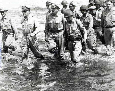 General Douglas Macarthur Wades Ashore At Leyte On His Return To The