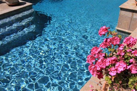 Stonescapes mini pebbles aqua white pool finish carries the same color as distressed denim to further enhance feelings of familiarity and happiness. StoneScapes® | National Pool Tile Group | Pool colors ...