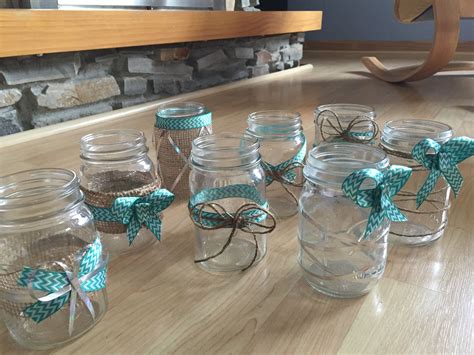 Simple Mason Jars Wrapped In Variations Of Ribbon Burlap And Twine
