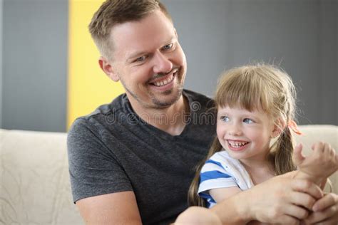 Happy Dad Holding Cute Cheerful Daughter Laughing And Having Good Time