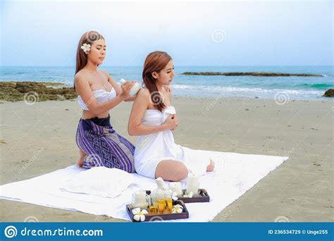 Two Asia Women Doing Spa Massage Together On The Tropical Beach Stock Image Image Of Girl