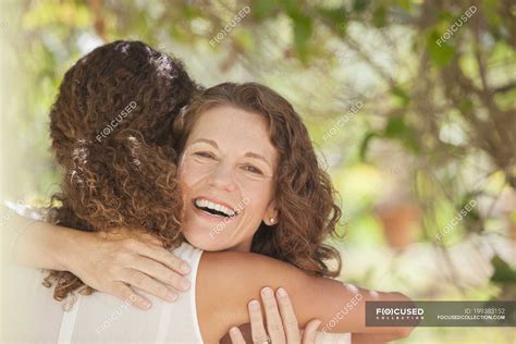 Happy Beautiful Mother And Daughter Hugging Outdoors — Woman Front