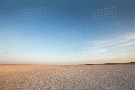 Dry Ground Reaching Into The Horizon Stock Photo Dissolve