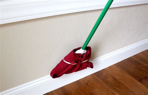 There’s a way to clean your baseboards without getting on your hands