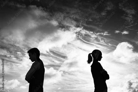Silhouette Of Upset Man And Woman With Backs Turned Away From Each
