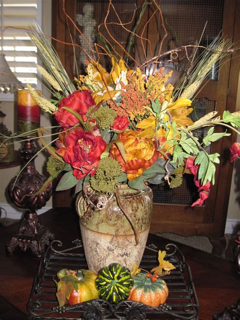 Fruit bowls aren't for the counter or dining room table alone. Fall coffee table arrangement | Coffee table arrangements ...
