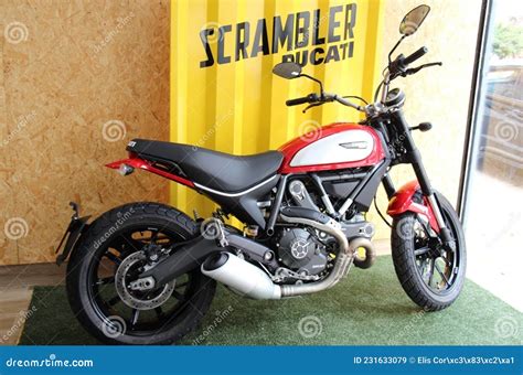 Ducati Scrambler Icon Side View Of A Custom Motorcycle Colored Red