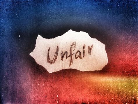 On The Dark Blue And Yellow Background Colors The Word Unfair Written