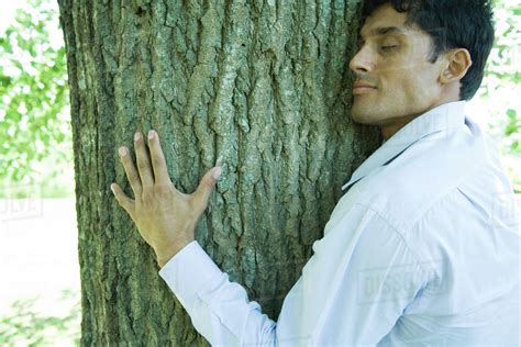 Man Hugging Tree Stock Photo Dissolve